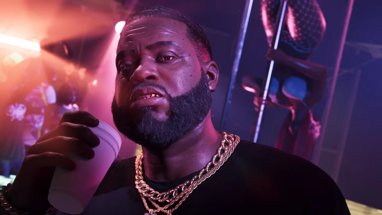 Close-up of Boobie Ike drinking from a foam cup under pink and purple club lighting, a dancer on a pole out of focus behind him.