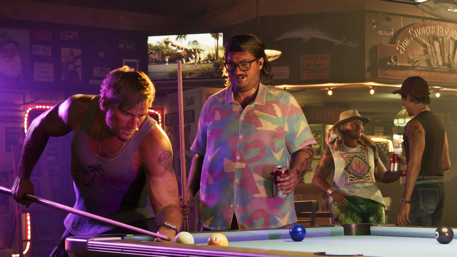 Cal Hampton standing with a beer can beside a purple-lit pool table while another player leans in to take a shot, a busy bar room behind them.