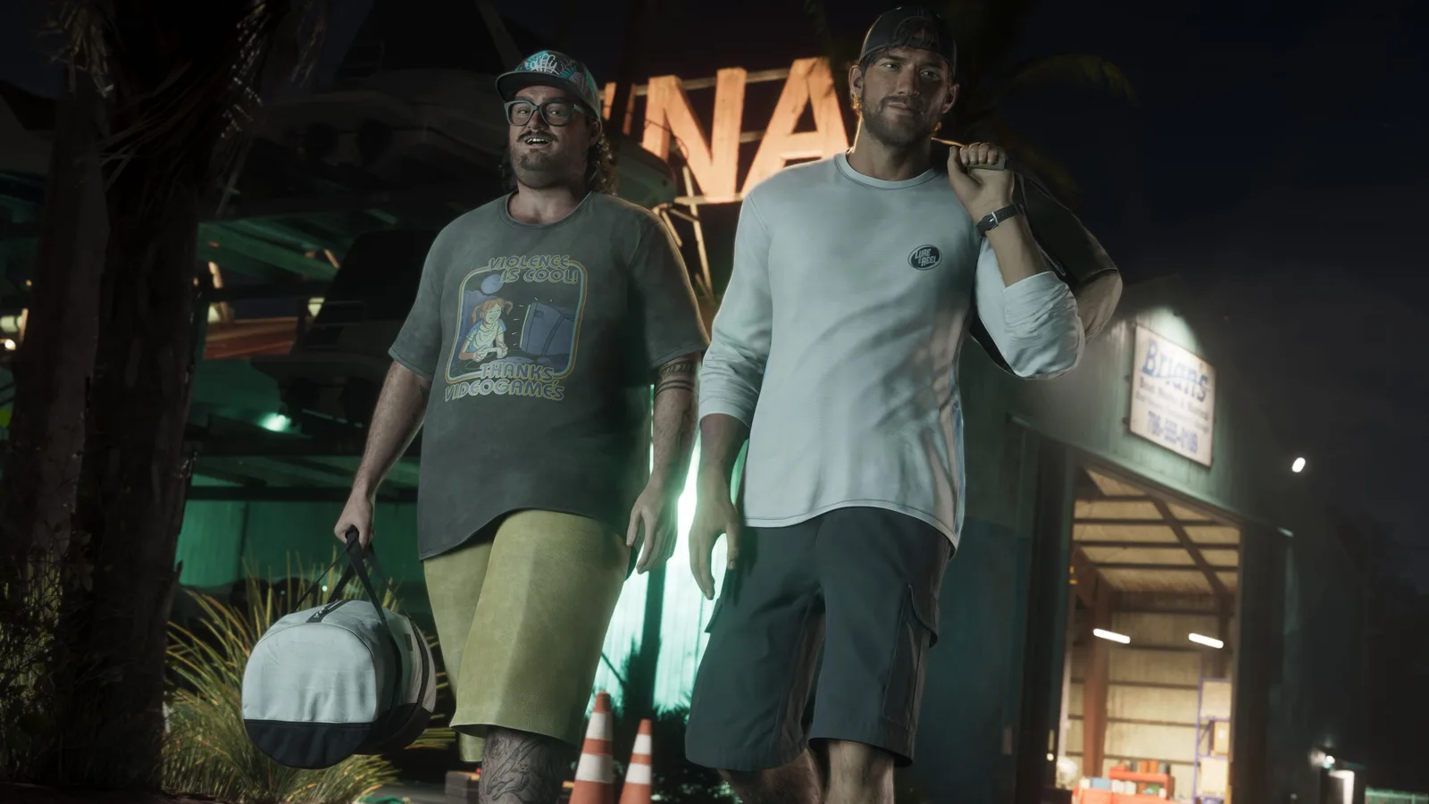 Cal Hampton carrying a duffel bag along a floodlit dock at night beside a man in a white long-sleeved top, a moored boat behind them.