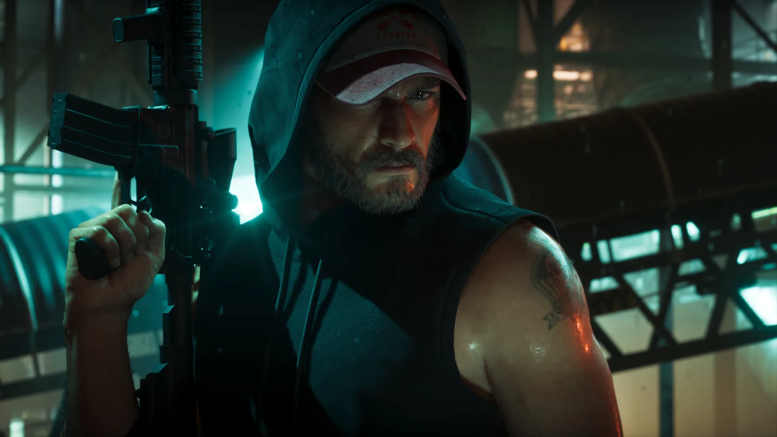 Jason Duval in a hooded sleeveless top and a Leonida cap holding a rifle upright in a dim teal-lit industrial space, tanks and steel framework behind him.