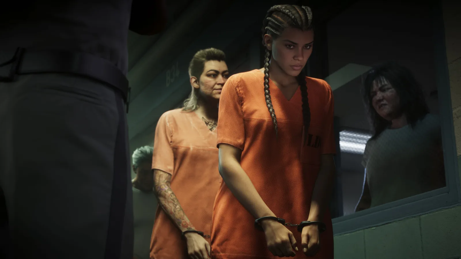 Lucia Caminos in an orange prison uniform and handcuffs walking a tiled corridor ahead of another inmate, a uniformed officer in the foreground and a woman watching through a window.