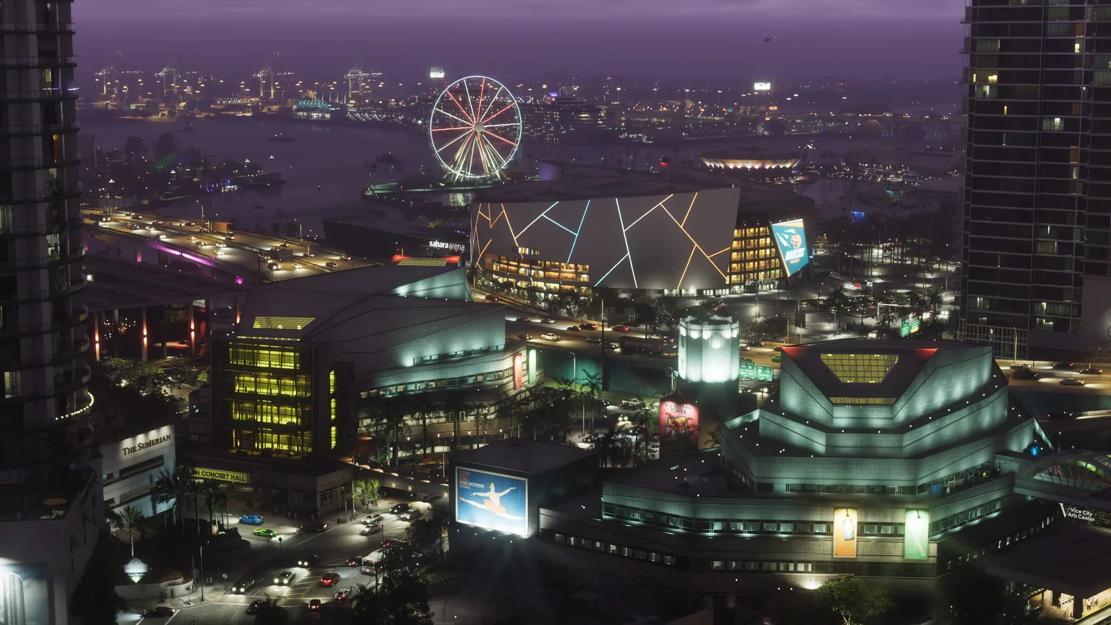 A night view over a downtown arts and arena district — a glowing angular arena, a concert hall and gallery blocks, an illuminated Ferris wheel on the waterfront and port cranes across the bay.