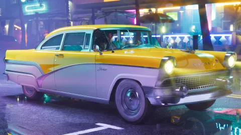 A two-tone yellow and white Vapid Stanier on a wet neon-lit street at night.